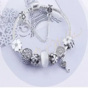 Charming White and Silver bracelet with Heart Locket and Flower themed charms